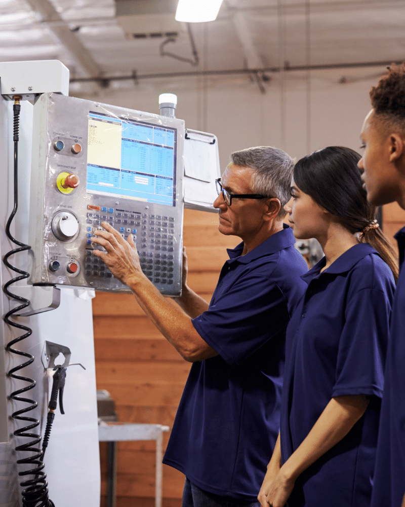 students on work placement in a mechanical engineering firm