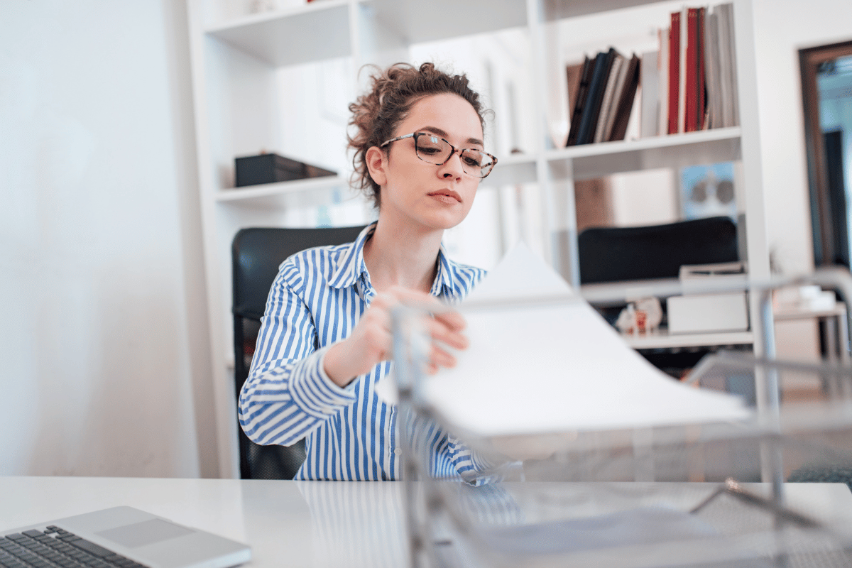 Student administrator going through paper based special considerations requests