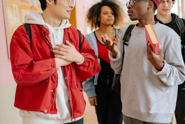 Students discuss school work on campus