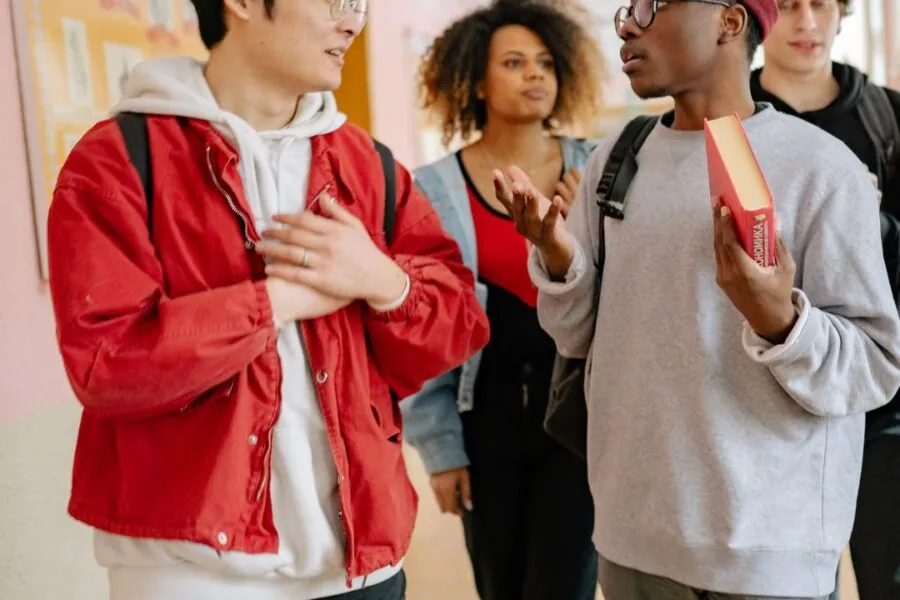 Students discuss school work on-campus